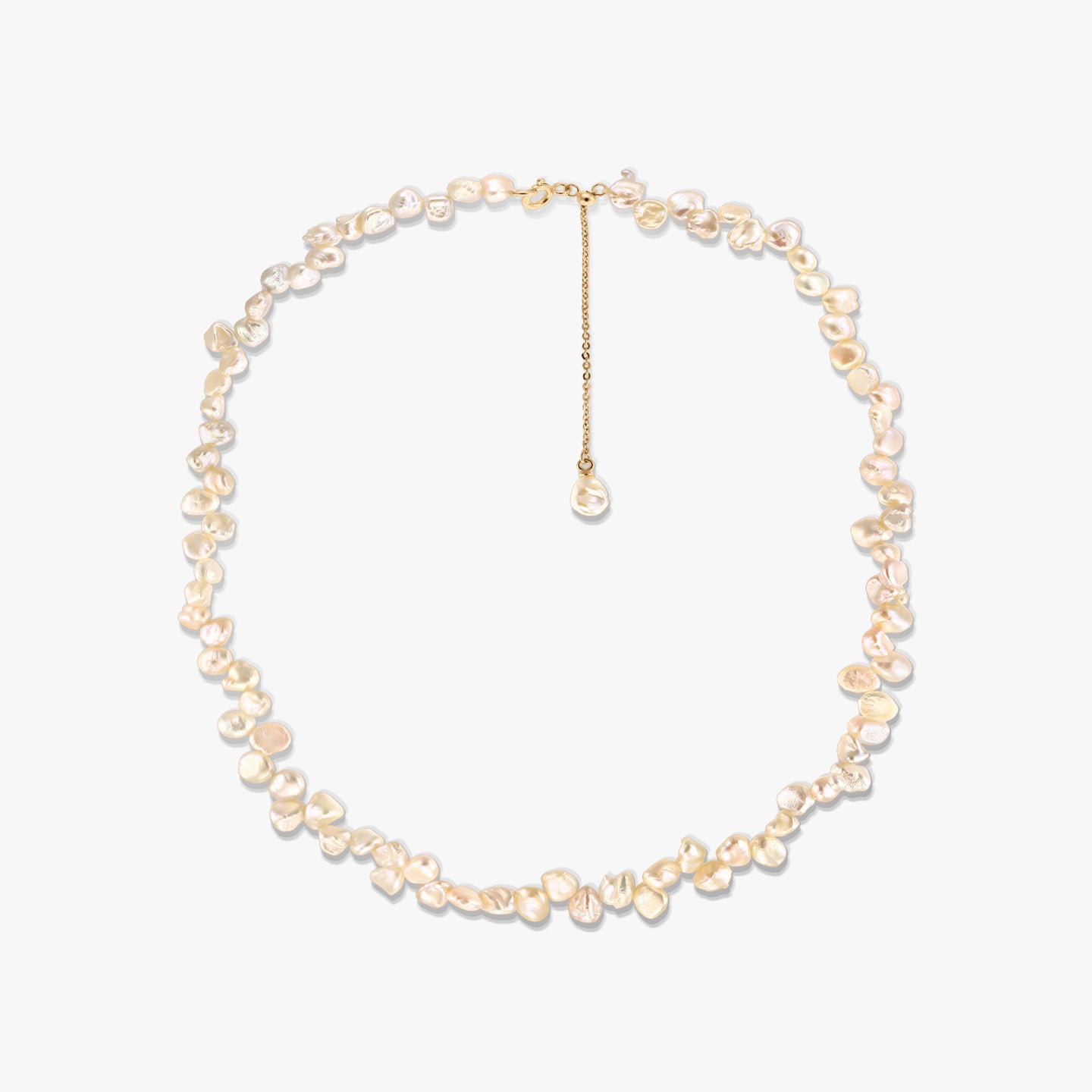 Gold-plated silver necklace with irregular pink keshi freshwater pearls and an adjustable chain extender, photographed on a white background.