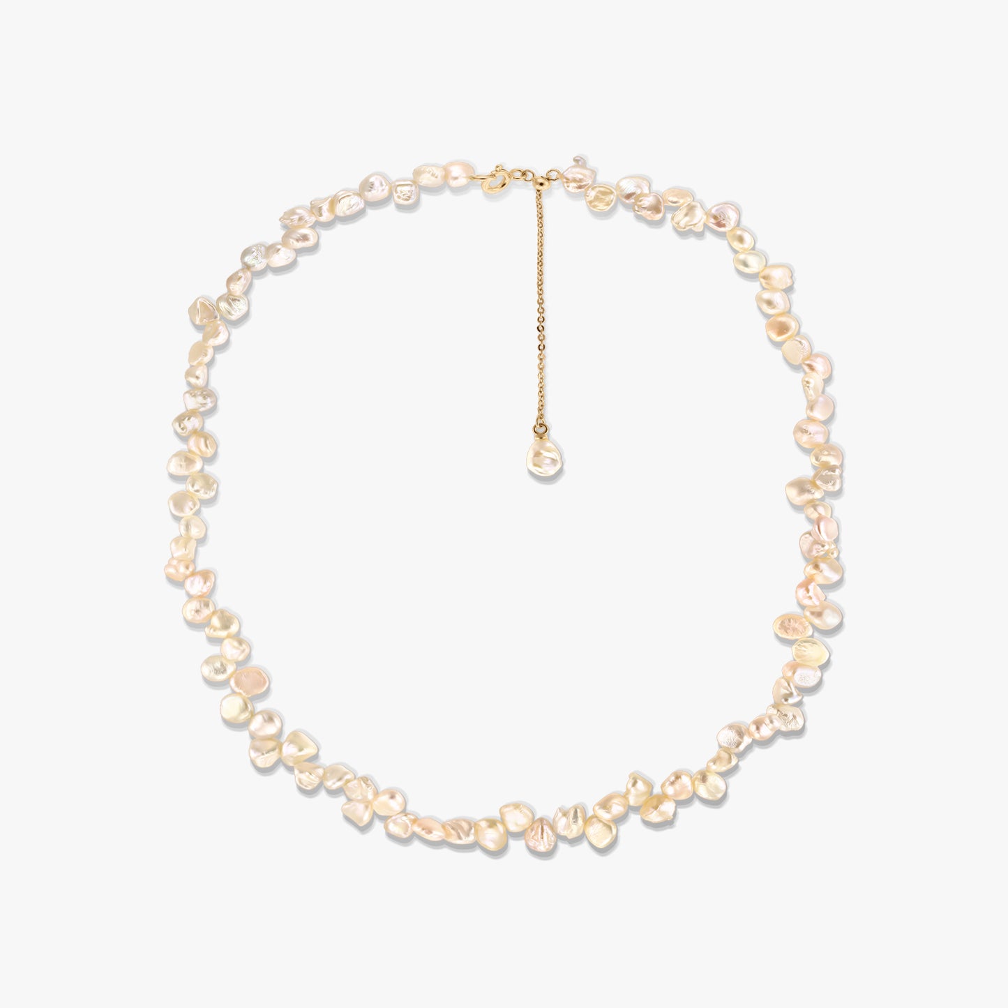 Gold-plated silver necklace with irregular pink keshi freshwater pearls and an adjustable chain extender, photographed on a white background.