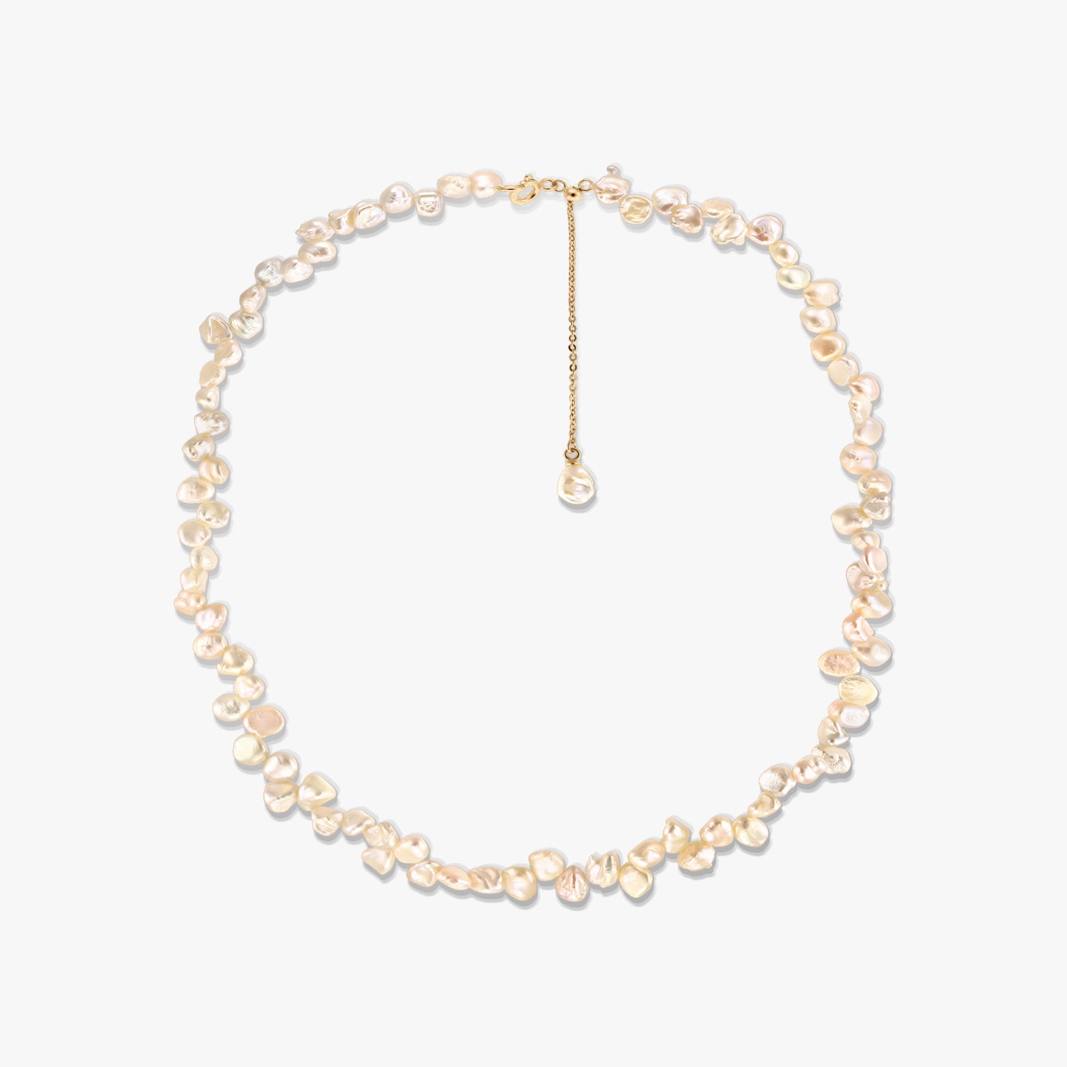 Gold-plated silver necklace with irregular pink keshi freshwater pearls and an adjustable chain extender, photographed on a white background.
