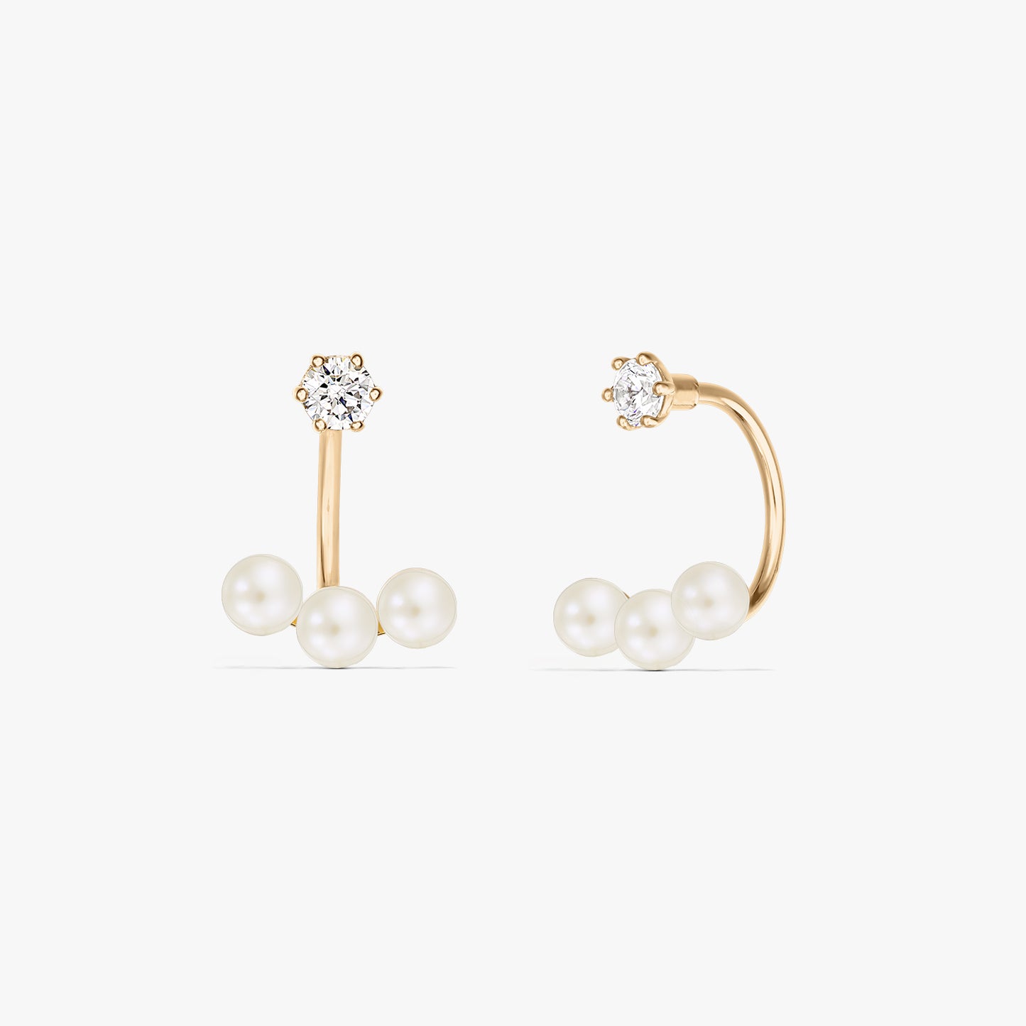 Квадратна продуктова снимка на чифт обеци тип ear jacket от 14K жълто злато с три естествени перли под малък кръгъл щифт, на чисто бял фон.